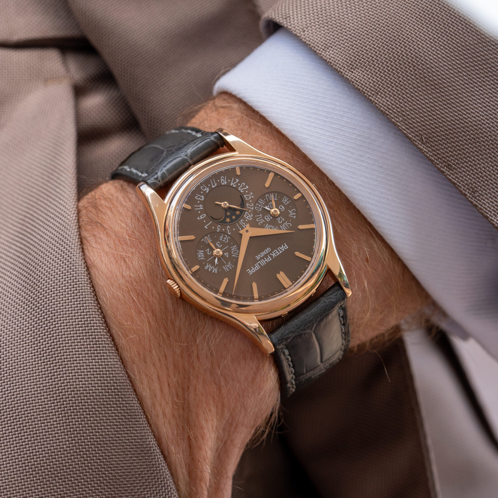Rose-gold Patek Philippe perpetual calendar with brown dial and moonphase, worn on the wrist
